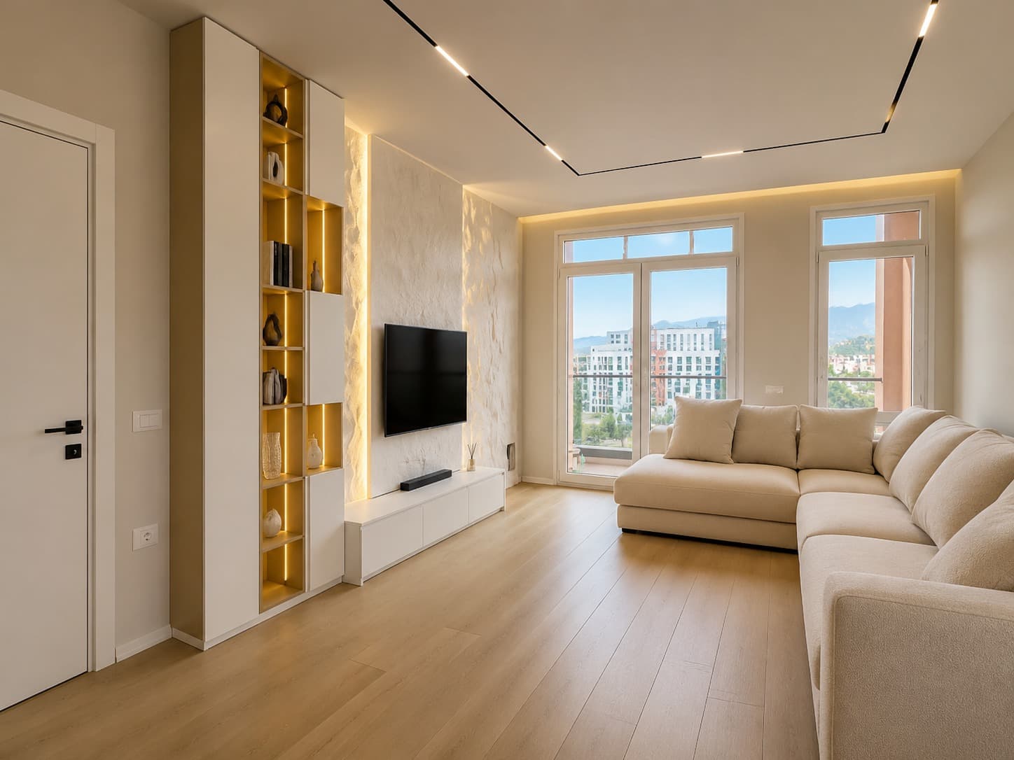 Bright living room with a gold-lit display cabinet and pale sectional sofa