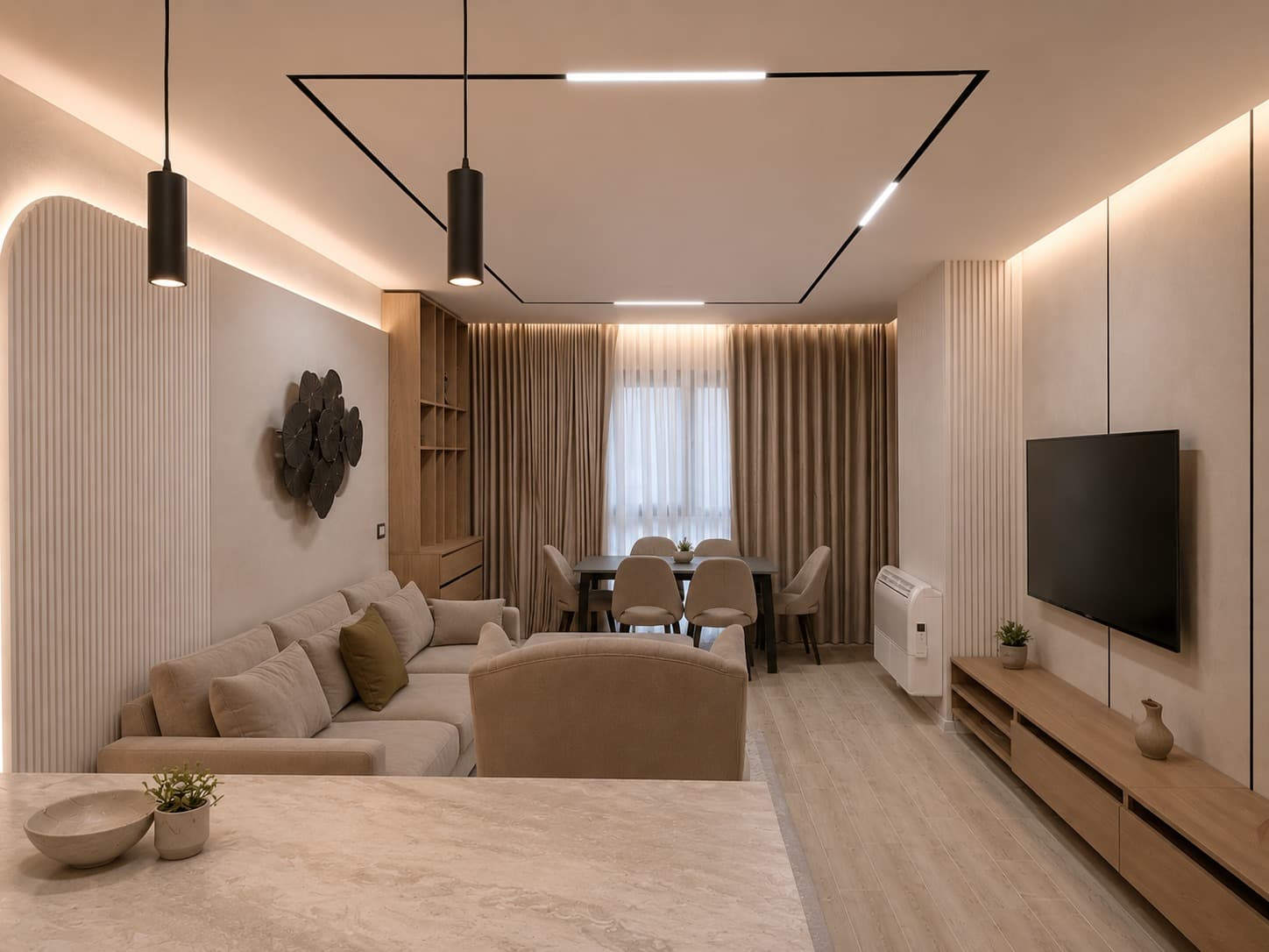 Open-plan living and dining room with sculpted wall panels and bespoke oak joinery